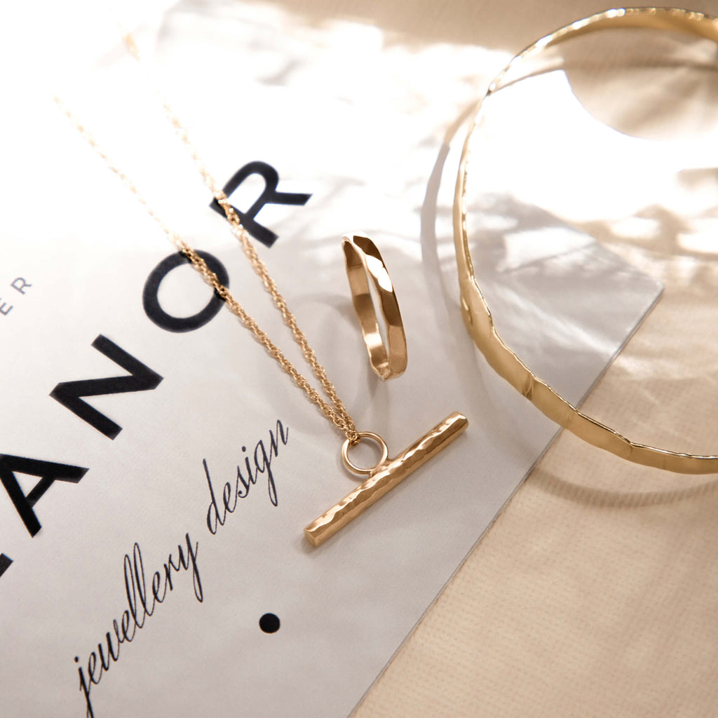gold earth collection, gold earth ring, hammered jewellery collection, hammered earth bangle, hammered gold tbar, handmade jewellery uk